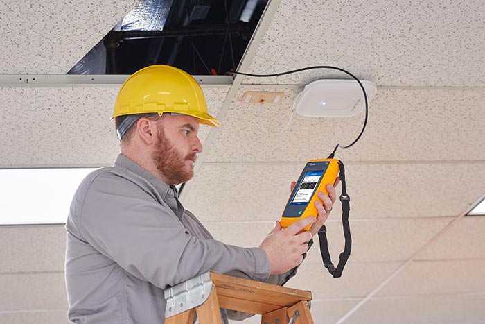 Fluke networks LIQ 100. Network + cable  tester in use